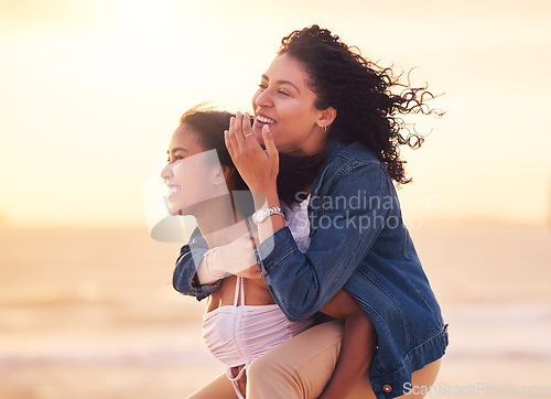 Image of Woman, friends and piggy back on beach for happy sunset travel vacation or summer holiday. Couple, friendship and relax quality time or playful bonding together on ocean sand for love or happiness