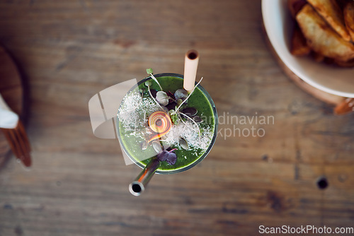 Image of Top view, fruit smoothie or green juice as healthy breakfast diet, weight loss or protein milkshake in home kitchen, house or restaurant. Morning wellness cup, detox drink or vegetable leaf cocktail