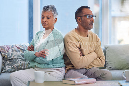 Image of Senior couple, angry and frustrated after fight with stress in marriage and conflict in relationship with divorce. Mature man with woman on living room couch and anger with silent treatment at home.