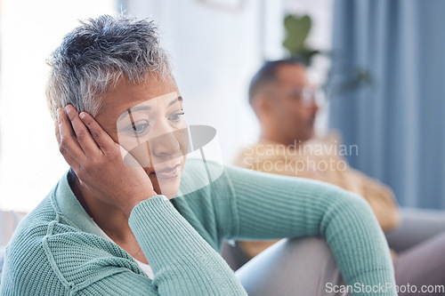 Image of Depression, divorce and senior couple with marriage problem, mental health risk and home stress or anxiety in living room. Thinking, sad and depressed elderly or old woman with partner for counseling