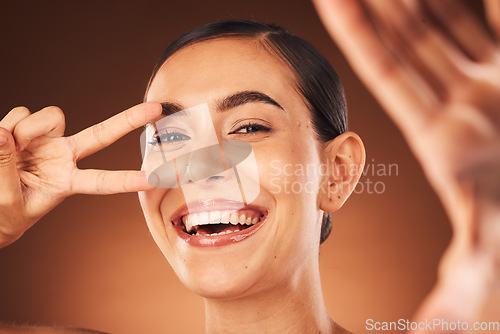 Image of Happy, selfie and woman with peace sign, smile on face and studio background for marketing or advertising. Beauty, skincare and happy woman taking self portrait, excited celebration healthy lifestyle