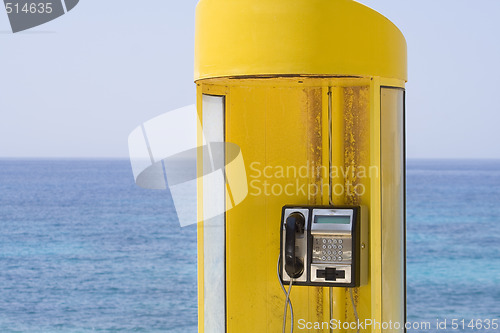 Image of Yellow phone, blue sea