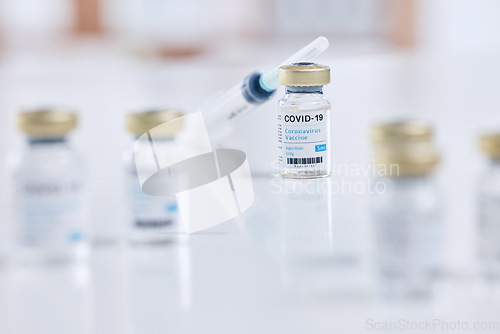 Image of Background, covid vaccine and injection, vial bottle and medicine for innovation and research with science product in hospital lab. Needle, corona virus safety in healthcare development for clinic
