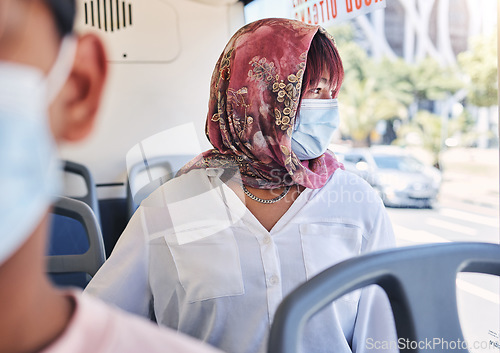 Image of Woman, muslim and bus with mask, covid and healthcare on transport in city, town or metro by window. Islam lady, covid 19 and ppe on transportation for travel, urban adventure or thinking of safety