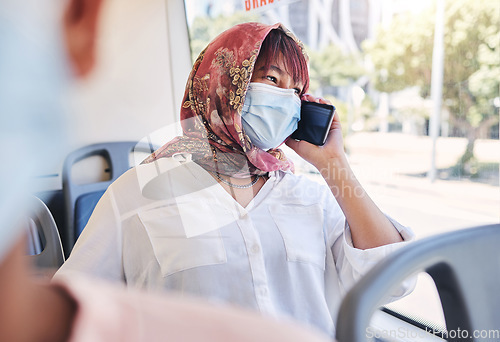 Image of Muslim, phone and bus woman in covid face mask talking of travel safety, compliance and health information or networking Islamic, hijab international girl travel on city transport with cellphone call