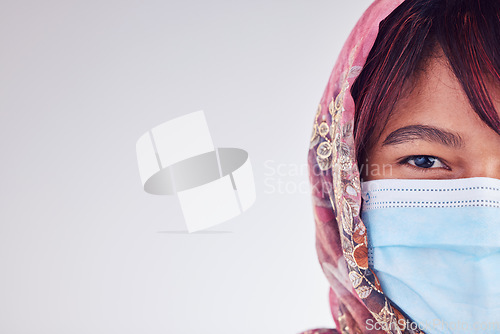 Image of Covid face mask, muslim woman and mockup, healthcare risk or safety compliance on studio background space. Portrait islamic lady in hijab from Malaysia, corona virus and medical wellness with mock up
