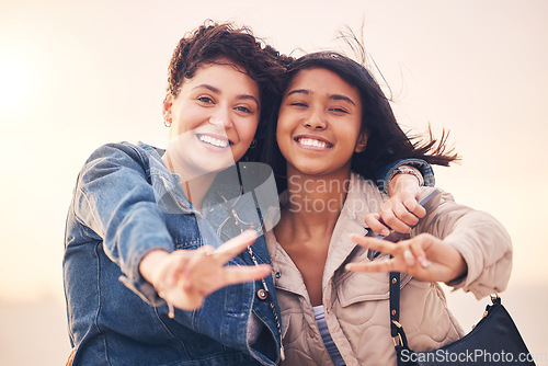 Image of Lgbtq, couple and peace sign portrait of interracial lesbian women together on travel adventure. Summer, friends and smile of people in miami on vacation with happiness, hug and freedom lifestyle