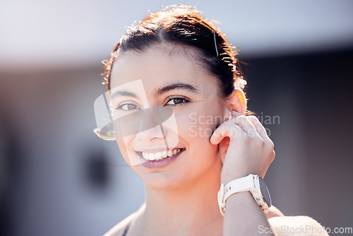 Image of Fitness, portrait and sports woman using headphones for music, podcast or motivation in running training in Los Angeles. Runner, face and happy girl athlete ready for a workout or exercise in summer