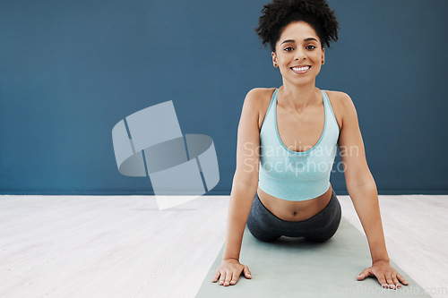 Image of Exercise, yoga and cobra pose with black woman for workout, exercise and wellness studio mockup with a smile, happiness and health. Portrait of female happy about fitness, body and mental health