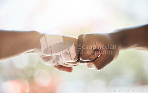 Image of Fist bump, race solidarity and hands of team together for team building support, diversity and partnership collaboration. Bokeh background, racism and friendship greeting for teamwork welcome