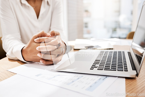 Image of Hands, laptop and business at the office for decision making, planning or consultation discussion. Hand fold of employee worker on computer work desk for corporate plan or strategy at the workplace