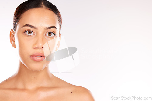 Image of Skincare, beauty and portrait of Latin woman on a white background studio for dermatology, body care and heath. Wellness, spa and face of girl with facial treatment, skincare products and cosmetics