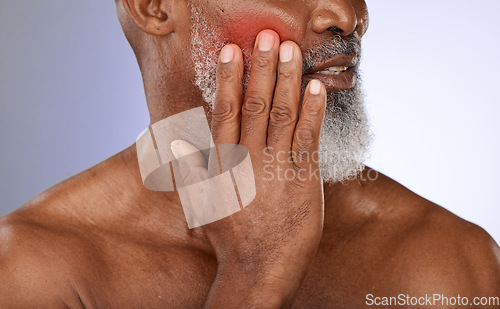 Image of Senior man with cheek pain in studio with tooth ache, illness or dental problem in his mouth. Sick, painful and elderly guy in retirement with teeth cavity and sore face isolated by purple background