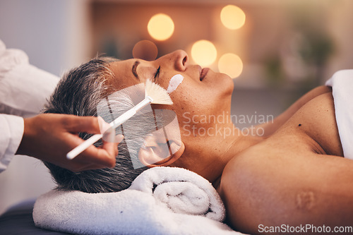 Image of Spa, facial and senior black woman with mask for skincare, beauty and luxury treatment at beauty salon. Wellness, face massage and mature female relax on holiday, vacation and retirement at resort