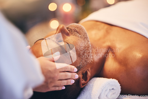 Image of Hands, old man and head massage at spa for wellness, relax and health. Bokeh, peace and zen with elderly male on massage table with masseuse for stress relief, facial treatment or physical therapy.