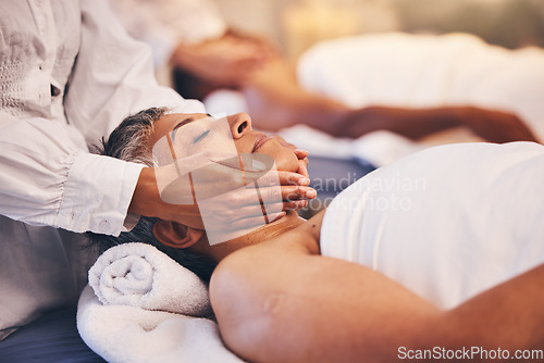 Image of Spa, facial and massage of senior woman for peace, relaxation and wellness procedure lifestyle. Health, physical therapy and masseuse at luxury resort massaging client on salon treatment bed.