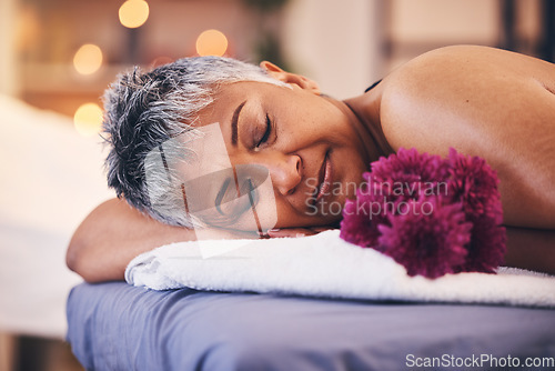 Image of Senior, woman and sleeping face on massage bed for luxury, wellness and beauty treatment. Spa, relaxation and calm person resting at beauty salon for retirement body care pamper appointment.