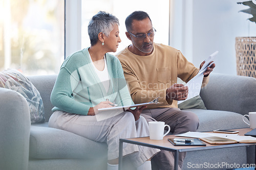 Image of Finance, documents and senior couple on sofa with bills, paperwork and insurance checklist in home, life or asset management, Elderly black people on couch with financial, retirement or mortgage debt