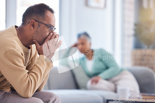 Image of Thinking, divorce and old couple with financial stress, money problems or fighting about mortgage bills at home. Divorce, depression or frustrated old man with a senior partner after argument on sofa