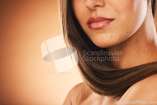 Image of Beauty, hair care and woman in studio with healthy hair for brazilian, keratin or botox treatment. Health, cosmetic and girl with long and shiny hair style by brown background with mockup space.