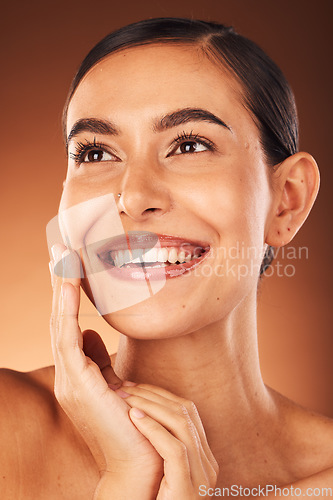 Image of Skincare, beauty and face of model in studio with lipstick or lip gloss on mouth after grooming with cosmetics product. Smile, girl or happy woman with self love or facial makeup in self care routine