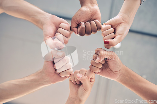 Image of Motivation, teamwork group or collaboration fist bump for trust, goal and success support below. Zoom workers hands, team building and growth commitment mission, winner vision or solidarity together