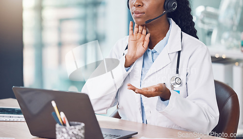 Image of Doctor, video call and telehealth on laptop consulting online in her office in the hospital. Medical expert or consultant with healthcare advice or help via the web or internet during covid lockdown