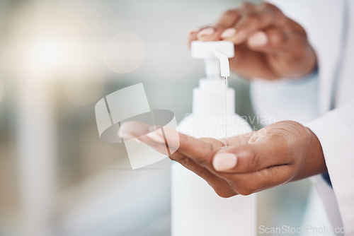 Image of Healthcare, cleaning and covid rules at hospital by doctor disinfect hands with hand sanitizer. Compliance, safety and corona control by health expert closeup of good hygiene in fresh clean workspace