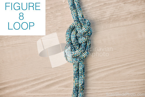 Image of Hiking rope, knot or exercise security on table, desk or wood background with mockup space for design. Abstract fitness zoom, sports safety texture or military support of figure eight fabric pattern