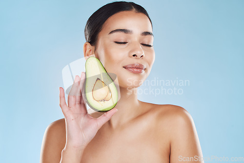 Image of Natural beauty product, woman skincare wellness and avocado fruit for sustainable face skincare. Food hair mask health, nutrition vegetable diet lifestyle and cosmetic blue background portrait