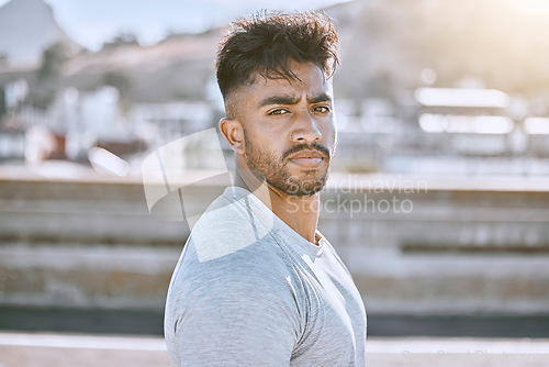 Image of Fitness, wellness and healthy personal trainer portrait for workout, training or exercise routine in the city. Cool, tough and young man or guy with determined face for motivation or training goal