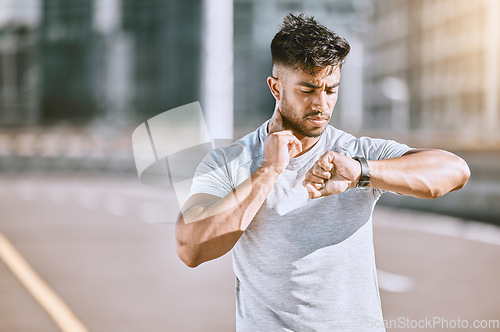 Image of Time, fitness and runner looking at watch for running speed, pace and steps in routine workout, exercise and city training. Portrait of a confused man checking wellness, endurance and cardio health.