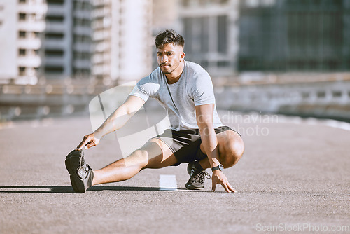Image of Fitness muscles stretching in city street, young man daily jogging and morning workout training. Physical warmup activity, healthy wellness coaching, sports practice and running for cardio exercise.