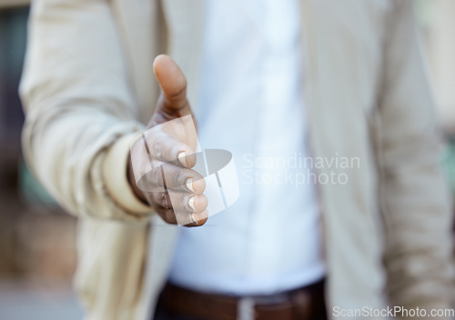 Image of Businessman hands with a handshake greeting or deal on collaboration with a b2b agreement. Closeup of a successful African man working in management welcoming a corporate partnership during interview