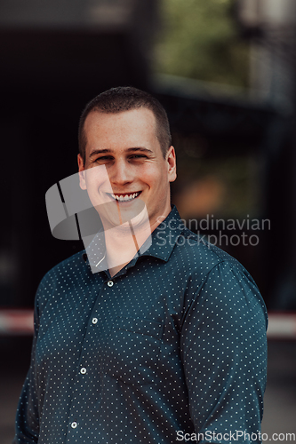 Image of A portrait of a modern man, exuding confidence and style, against an outdoor backdrop, showcasing his charisma and fashionable demeanor.