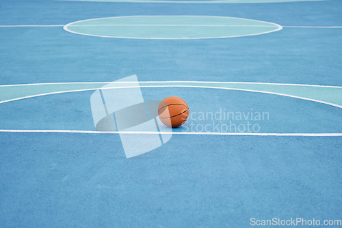 Image of Basketball sport ball in empty basketball court to play, train and practice for tournament game and training day. Summer sports exercise and fitness workout training or practicing for competition