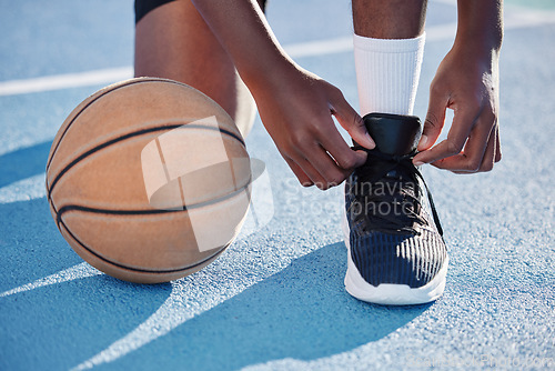 Image of Fitness man on a court with a basketball for training, exercise and a workout by playing sports in athletic shoes. African athlete living a healthy, wellness and motivational lifestyle in summer