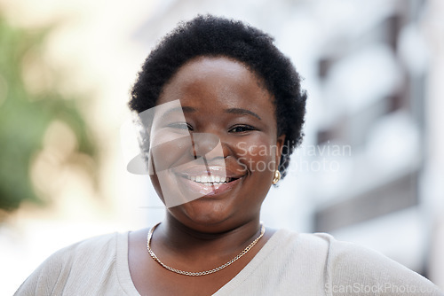 Image of Portrait face happy black business woman smiling in the city, looking excited to start her new corporate job. African American employee joyful at the start of career, motivation, ambition and vision