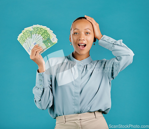 Image of Surprised, rich and finance businesswoman holding cash prize, savings investment or salary. Portrait of young, wealthy shocked female with lottery, jackpot or profit money after winning or investing