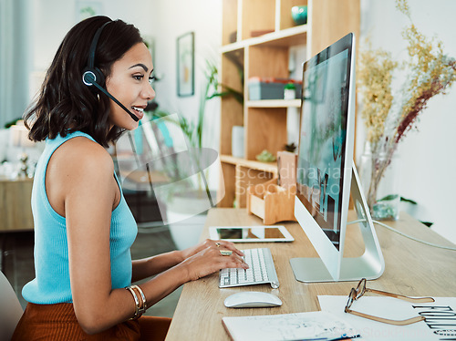 Image of Working, typing and talking customer service support agent online helping a client on a computer. Female web help digital call centre employee with headset giving internet advice or tech assistance