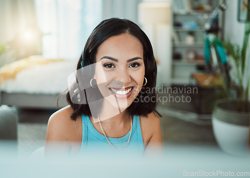 Image of Call center, customer service and sales support with a female agent or representative wearing a headset and remote working from home. Portrait of a young woman helping, assisting or talking on a call
