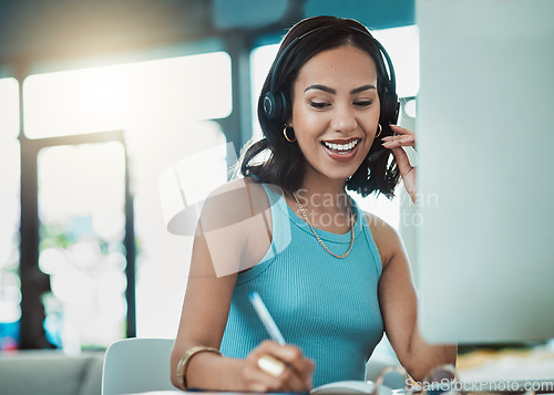 Image of Call center agent, customer service and freelance sales entrepreneur with headset being friendly on video call while working from home. Smiling operator and happy consultant doing remote virtual work