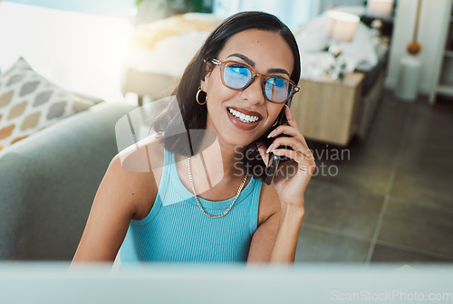 Image of Working from home freelancer talking on phone while doing remote work on computer. Smiling, happy and motivated woman thinking, consulting and planning idea with communication and network for startup