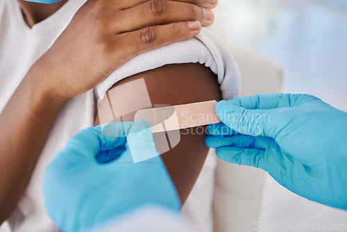 Image of Plaster bandage on arm for covid vaccine, injection and cure given to patient by a doctor in a hospital. Closeup of flu jab, antiviral shot and health treatment to boost immunity and prevent illness