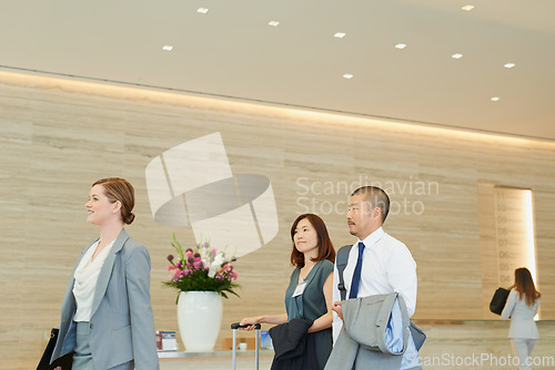 Image of Business, corporate team in hotel and walking to international meeting, company workshop and coaching seminar. Employee trade show, management work conference and executive job teamwork collaboration