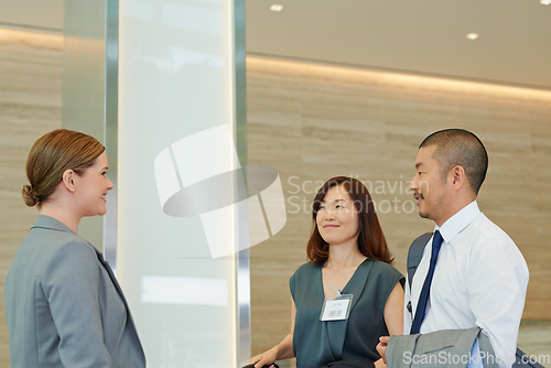 Image of Business people, hotel concierge and check in at luxury hospitality, corporate travel and asian people. Company employee at receptionist for work convention, travelling and staff book for conference