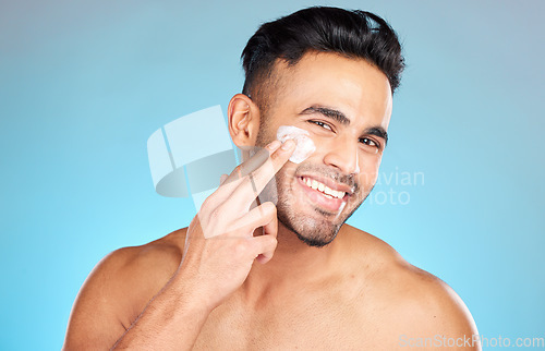 Image of Cream, face and skincare man in studio for beauty, cosmetics and product promotion mockup with smile happy for benefits. Skin care, dermatology and young model with sunscreen application in portrait