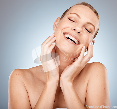 Image of Face, beauty and skincare with a model woman in studio on a gray background for luxury or wellness. Facial, cosmetics and antiaging with an attractive young female posing to promote natural treatment