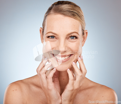 Image of Portrait, face and beauty with a model woman in studio on a gray background for natural skincare treatment. Happy, smile and luxury with an attractive young female posing to promote skin cosmetics