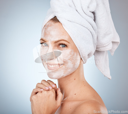 Image of Portrait, shower and skincare with a model woman in studio on a gray background for facial treatment or hygiene. Face, mask and natural antiaging with an attractive young female in the bathroom